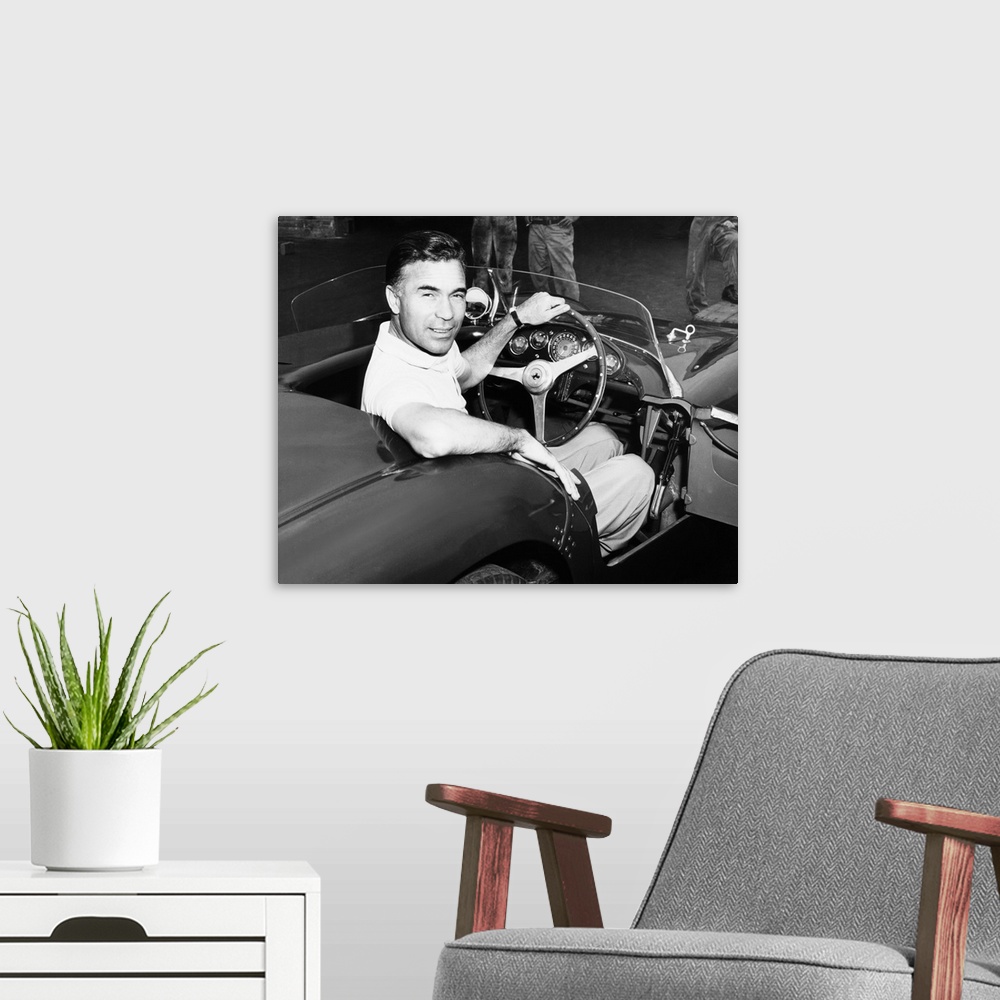 A modern room featuring Porfirio Rubirosa at the wheel of his Italian race car, a $17,000 Ferrari Mondial. Cleveland Pres...