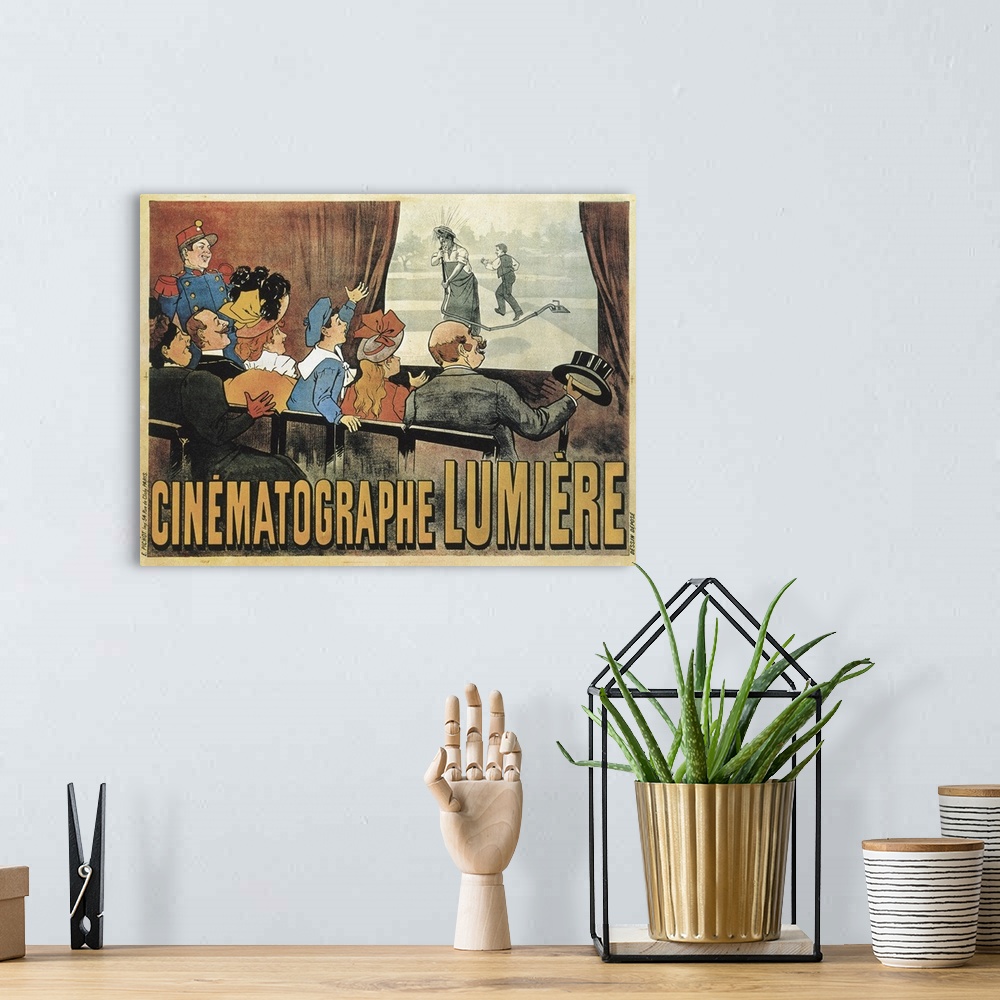 A bohemian room featuring LUMIERE, Louis and Auguste. Poster advertising the showing of L'Arroseur Arrose (The Waterer Wate...