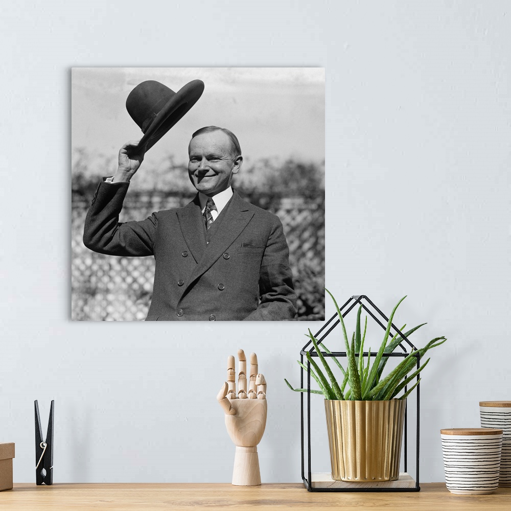A bohemian room featuring President Calvin Coolidge waves a hat presented to him by Smoki People of Prescott, Arizona. c. S...