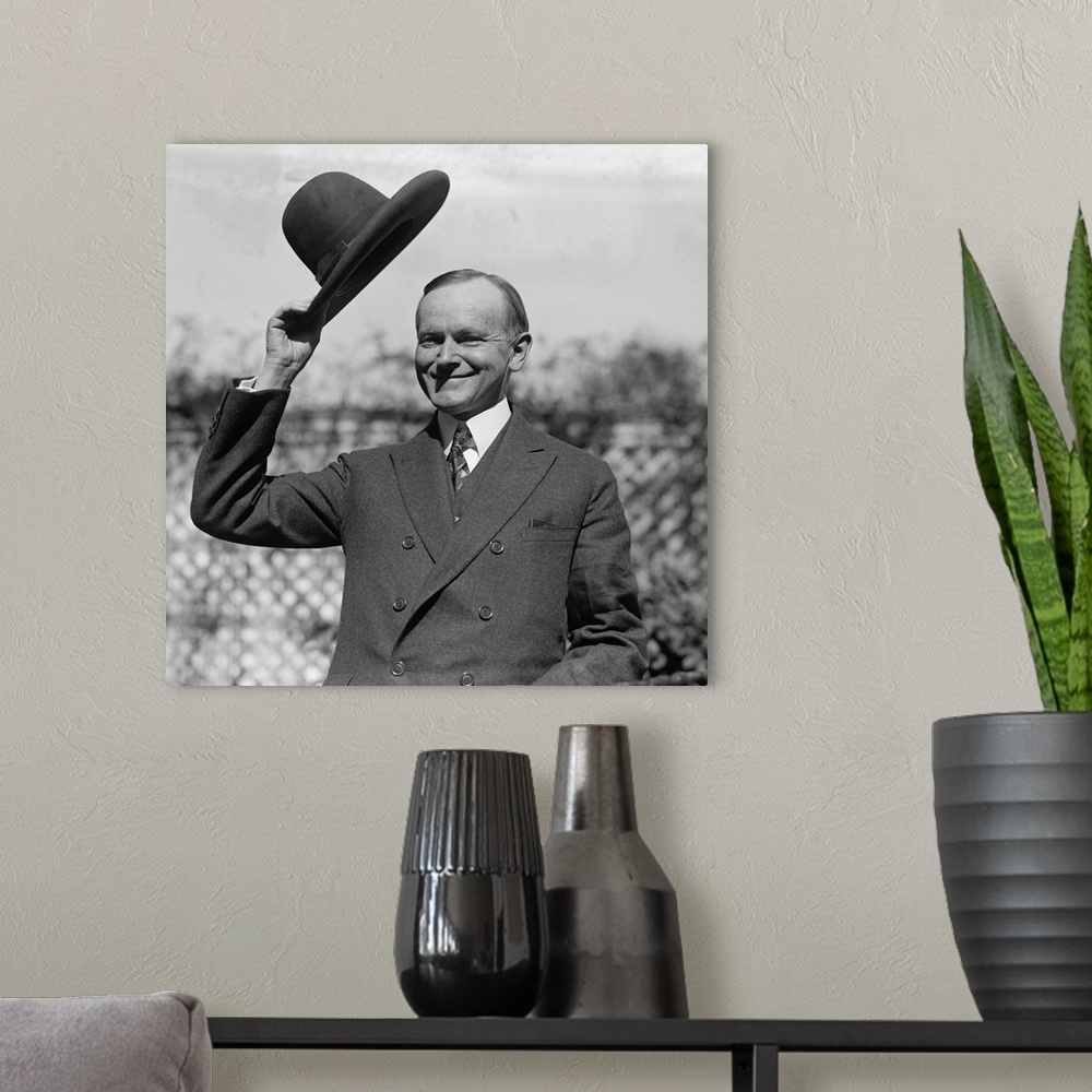 A modern room featuring President Calvin Coolidge waves a hat presented to him by Smoki People of Prescott, Arizona. c. S...