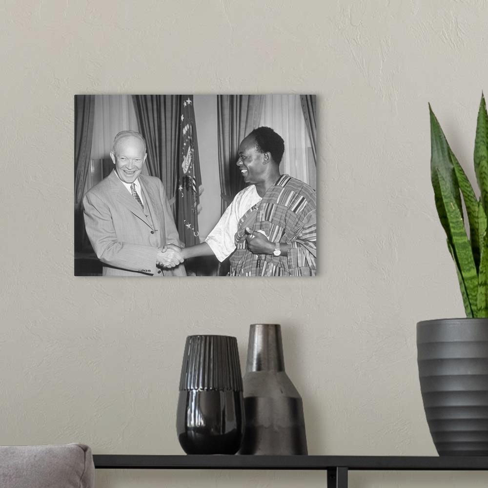 A modern room featuring President Eisenhower with Kwame Nkrumah, President of Ghana. Nkrumah is wearing a traditional gar...