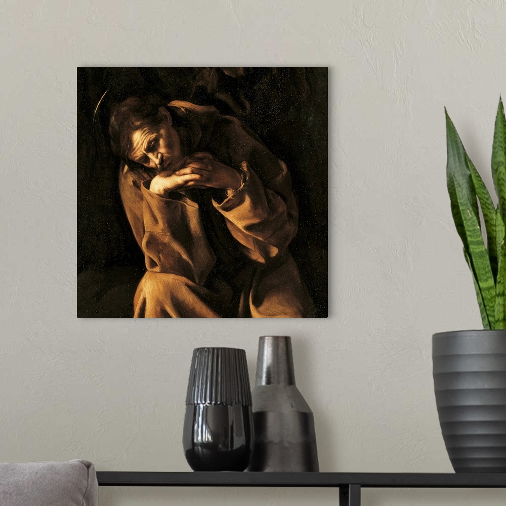 A modern room featuring Saint Francis in Prayer, by Merisi Michelangelo known as Caravaggio, 17th Century, 1606 -1607 abo...