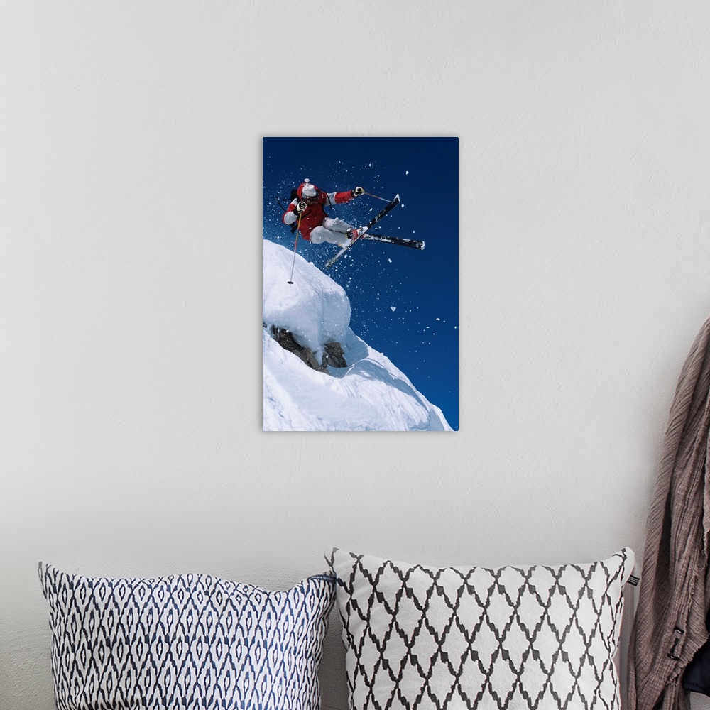 A bohemian room featuring Skier In Mid-Air Above Snow On Ski Slopes