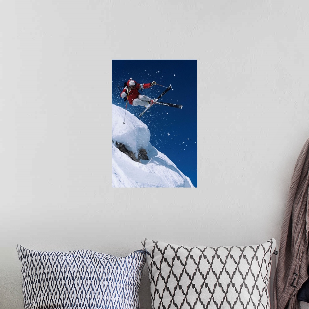 A bohemian room featuring Skier In Mid-Air Above Snow On Ski Slopes