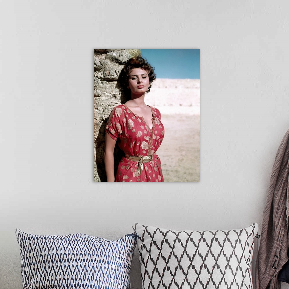 A bohemian room featuring Vintage publicity photo of actress Sophia Loren on the beach.