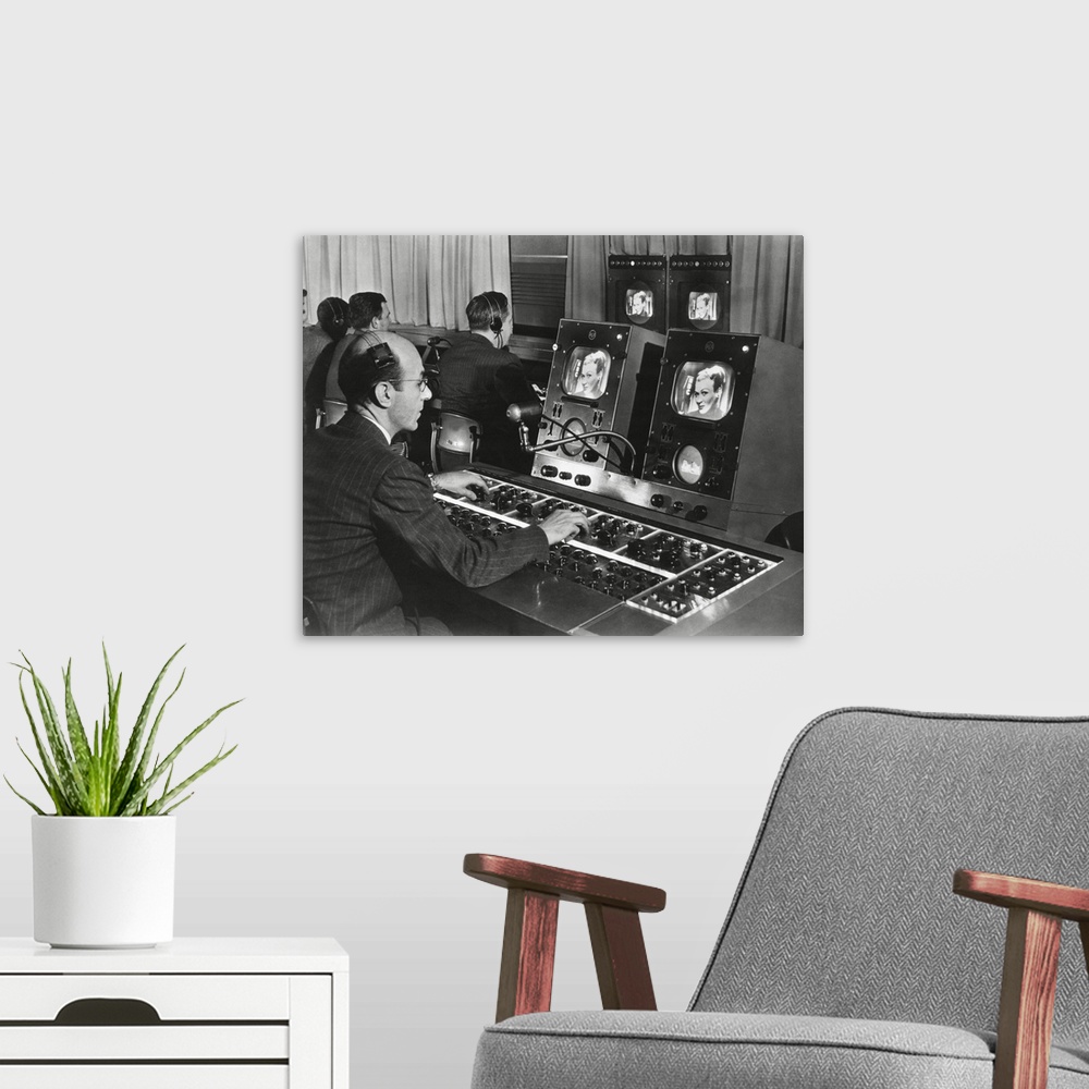 A modern room featuring Television studio engineer gets several views of the image and use the complicated set of dials t...