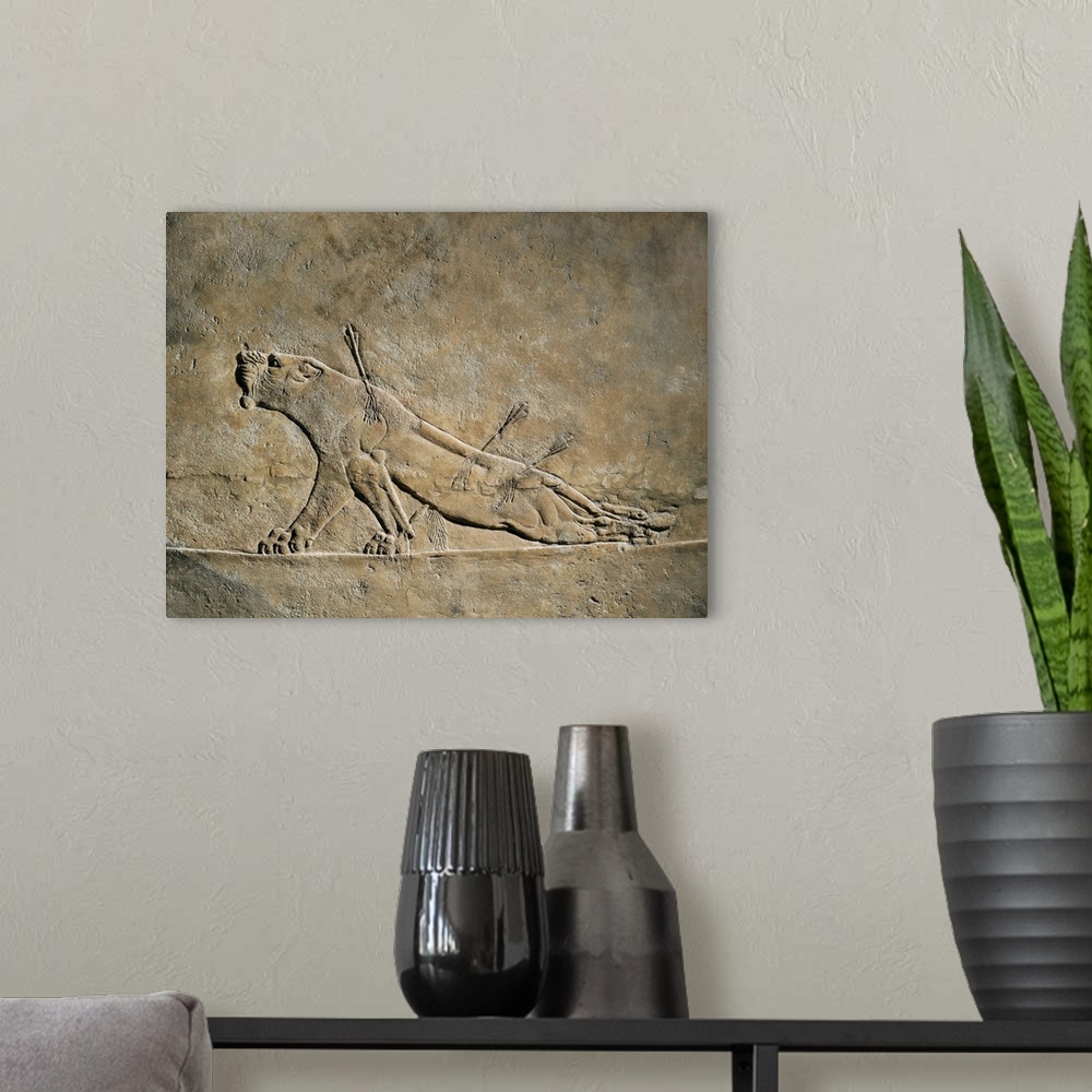 A modern room featuring The Dying Lion, Assyrian art