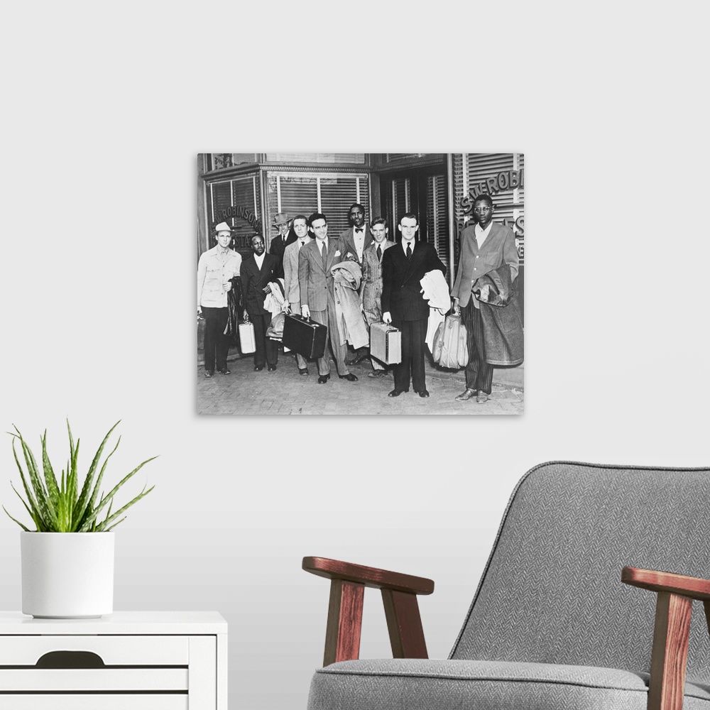 A modern room featuring The First 'Freedom Riders' Holding Suitcases Outside Office Of Attorney S.W. Robinson.