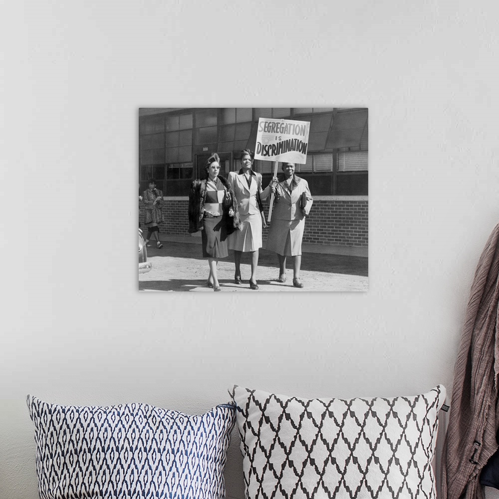 A bohemian room featuring Three African American Women With Sign Reading, 'Segregation Is Discrimination'. Houston