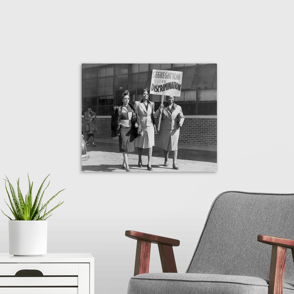 A modern room featuring Three African American Women With Sign Reading, 'Segregation Is Discrimination'. Houston