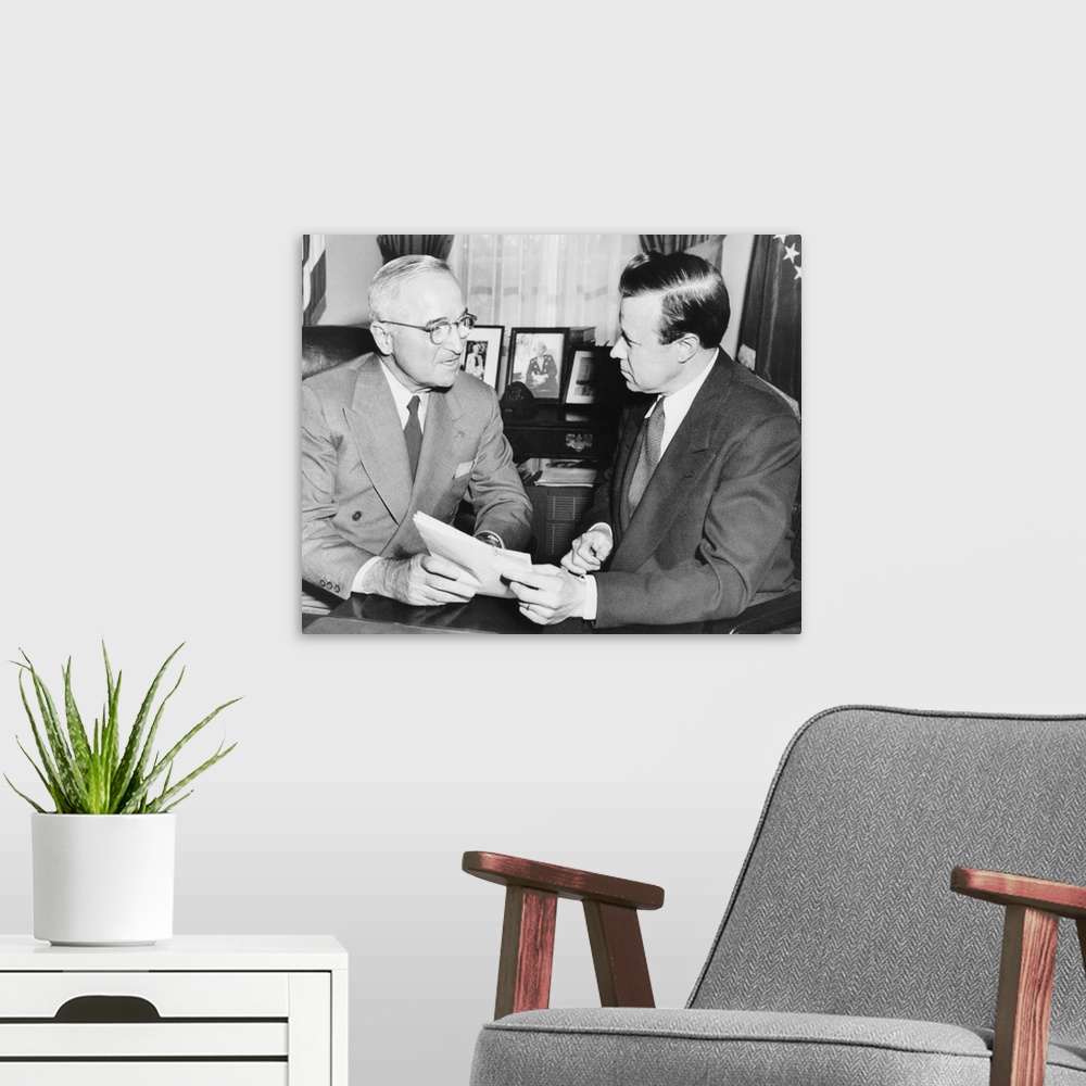 A modern room featuring Walter Reuther, new President of the CIO, with President Harry Truman, Dec. 12, 1952. In his last...