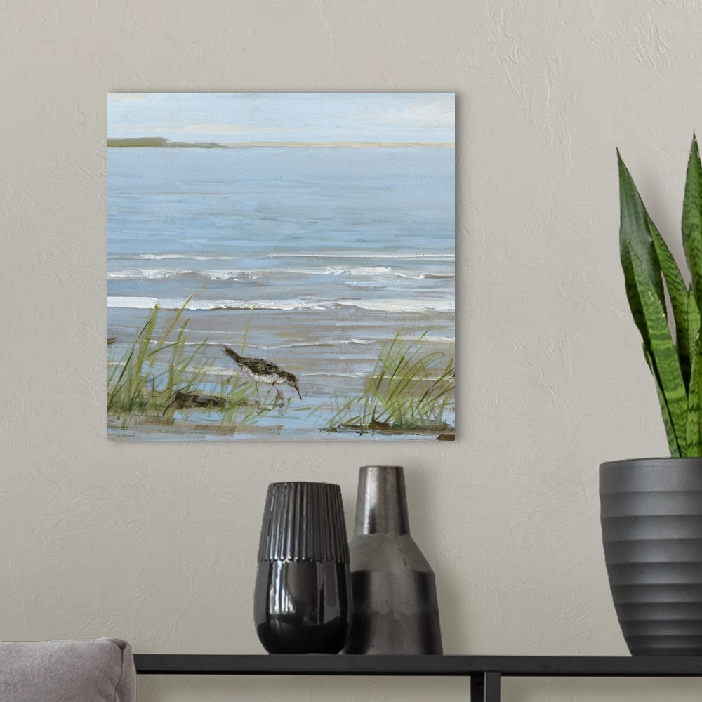 A modern room featuring Contemporary square painting of a seabird grazing a shallow shore with small waves in the backgro...