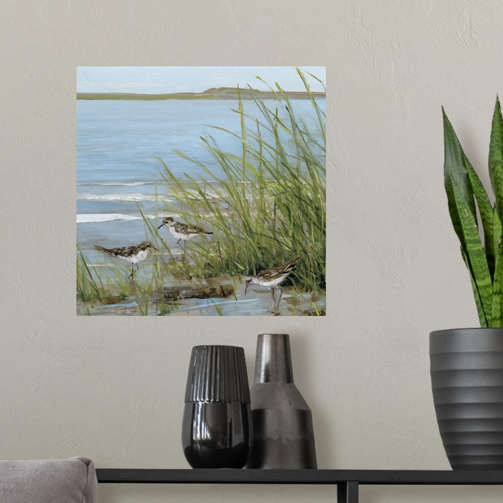 A modern room featuring Contemporary painting of seabirds grazing in a grassy sound with small waves breaking in the back...
