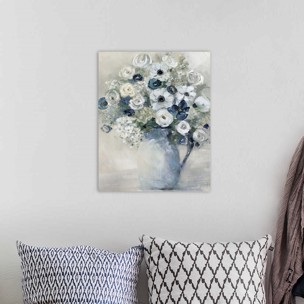 A bohemian room featuring Vertical artwork of a vase full of flowers in tones of blue, grey and white.