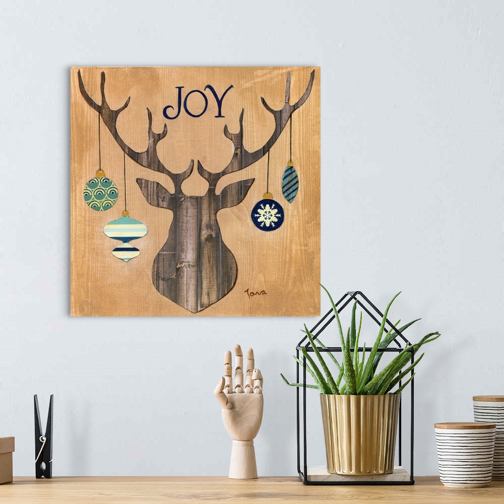 A bohemian room featuring A decorative seasonal piece with a wooden mounted deer that has ornaments hanging from the antlers.