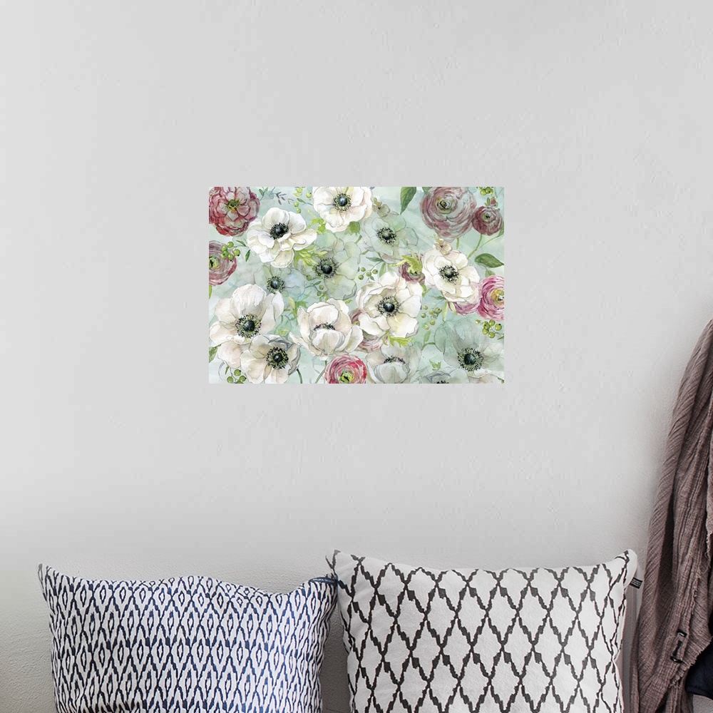 A bohemian room featuring A floral watercolor painting with a light blue-green background.