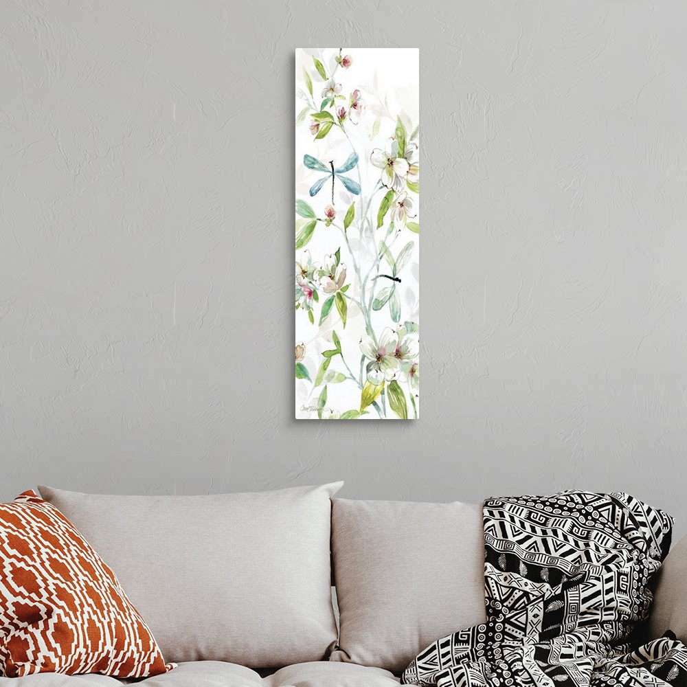 A bohemian room featuring A watercolor painting of two dragonflies flying among branches covered in flowers and leaves.