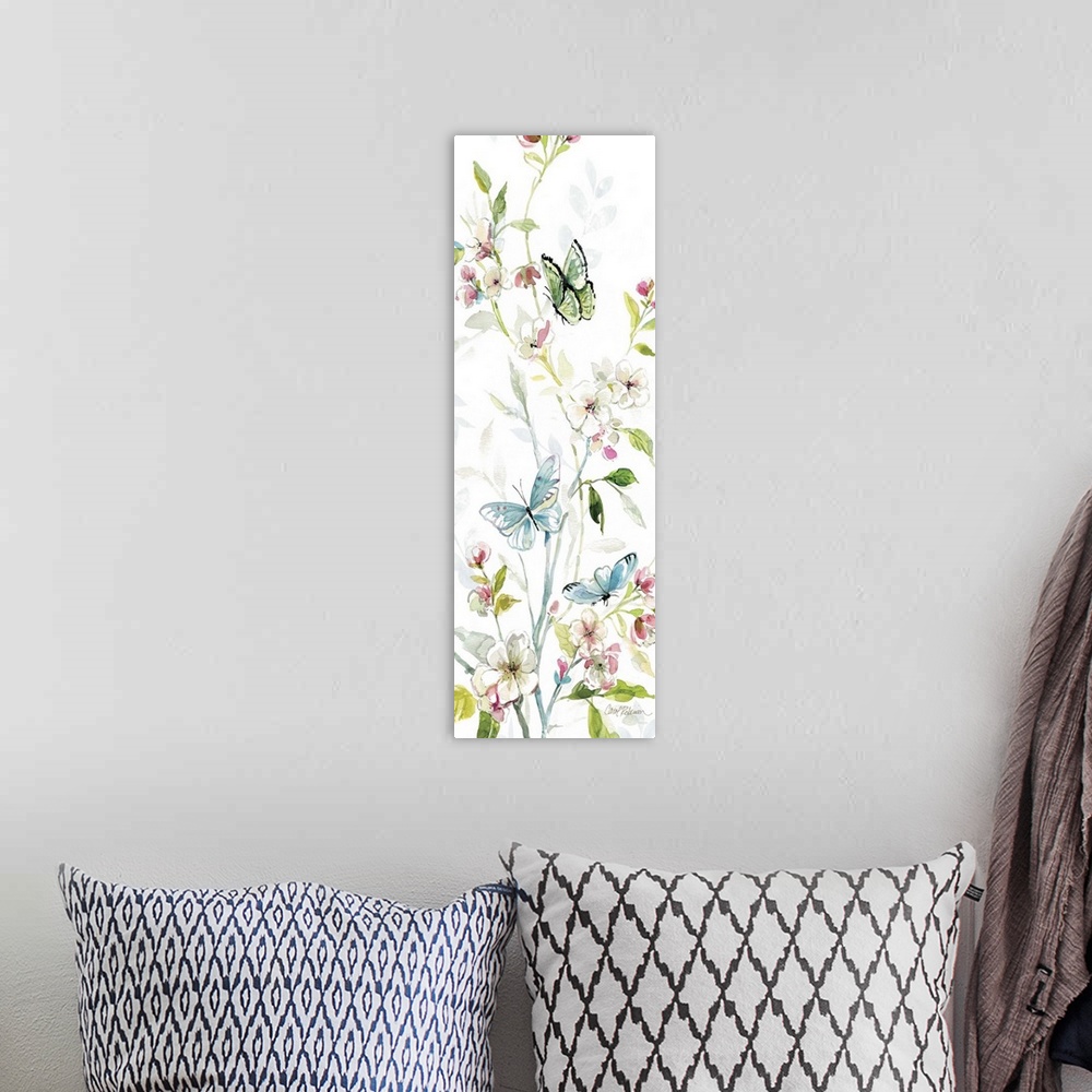 A bohemian room featuring A watercolor painting of three butterflies flying among branches covered in flowers and leaves.