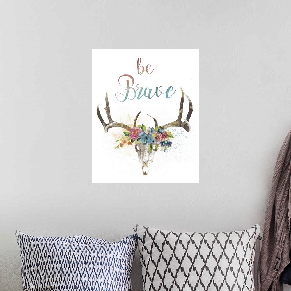A bohemian room featuring Illustration of a deer skull with watercolor flowers in between its antlers and the phrase "Be Br...