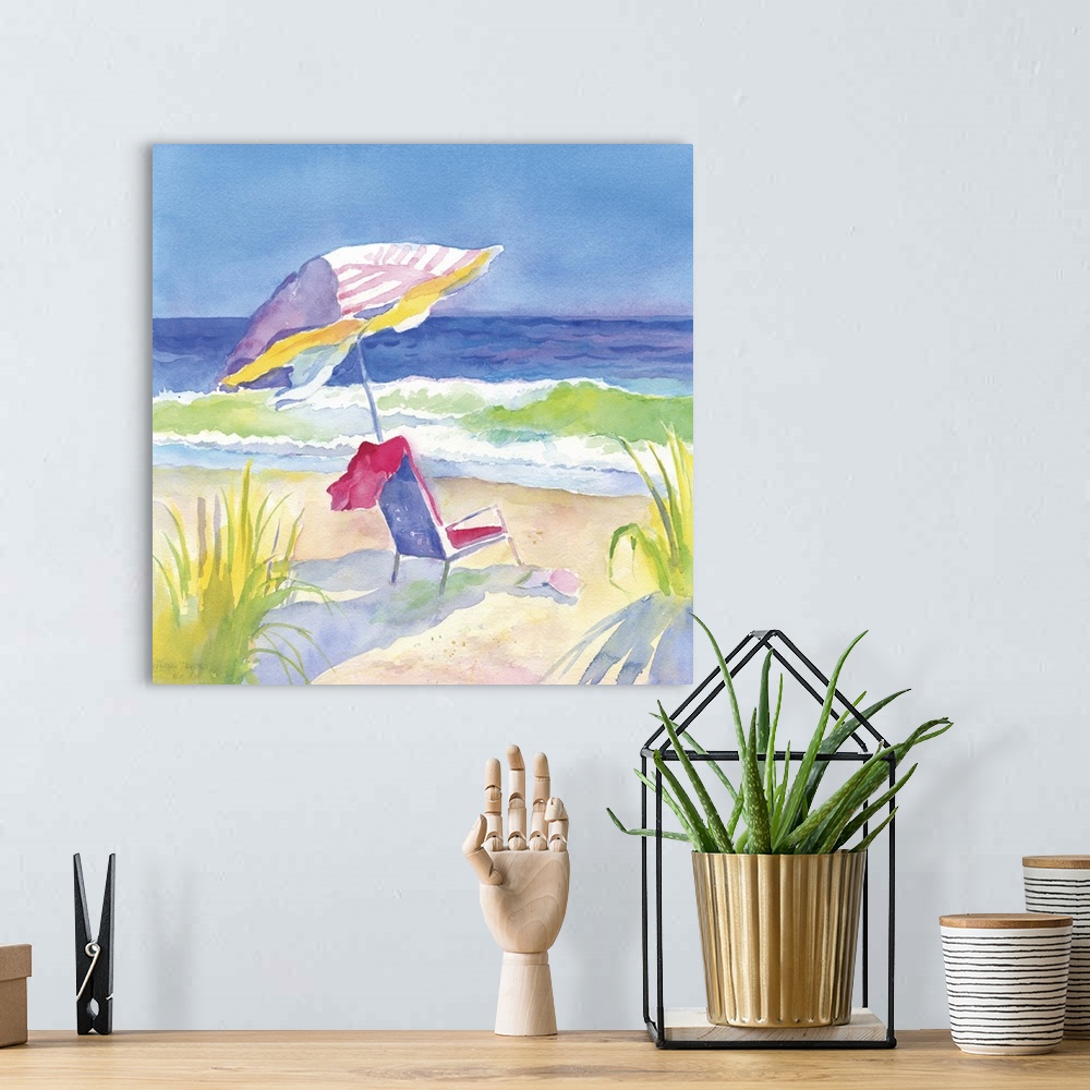 A bohemian room featuring Square watercolor painting of chair and umbrella on the beach in vibrant, warm colors.