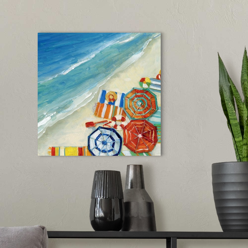 A modern room featuring Contemporary painting of an aerial view of umbrellas, beach blankets, and other beach accessories.