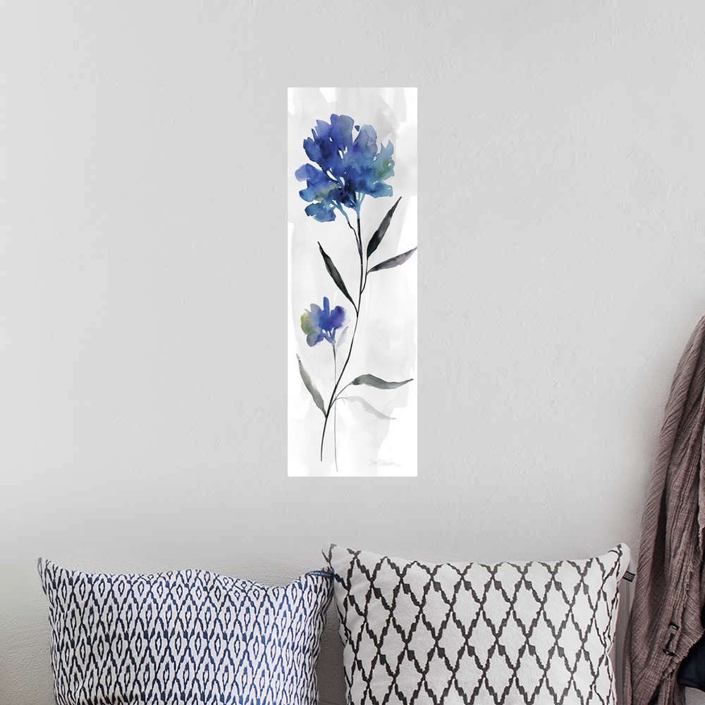 A bohemian room featuring Watercolor art print of a deep blue flower on a pale grey background.