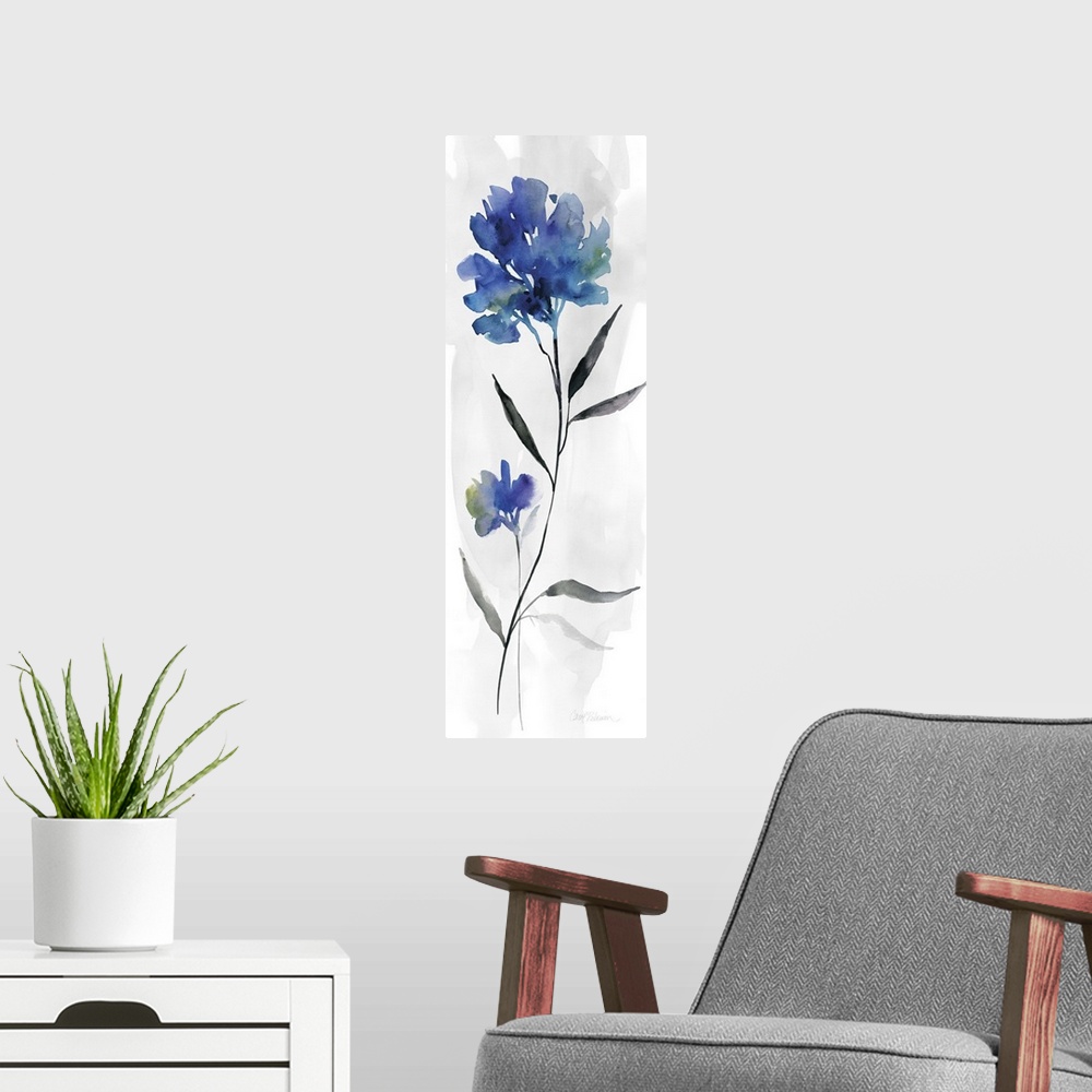 A modern room featuring Watercolor art print of a deep blue flower on a pale grey background.