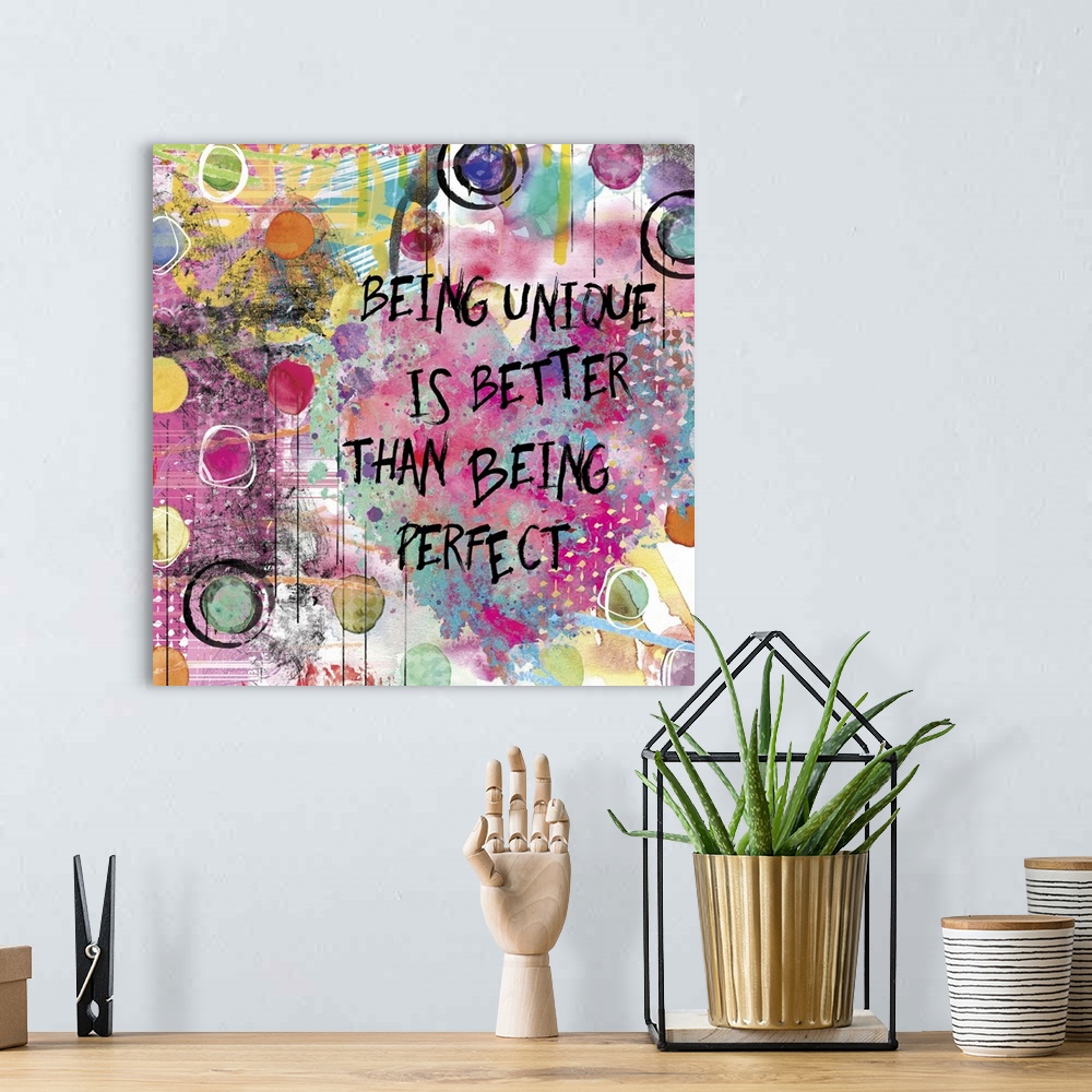 A bohemian room featuring Inspirational square painting with colorful designs, circles, and a large heart with the phrase "...