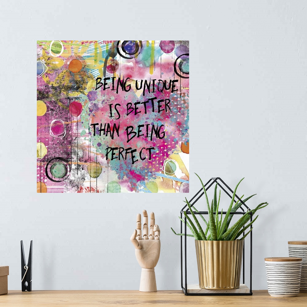 A bohemian room featuring Inspirational square painting with colorful designs, circles, and a large heart with the phrase "...