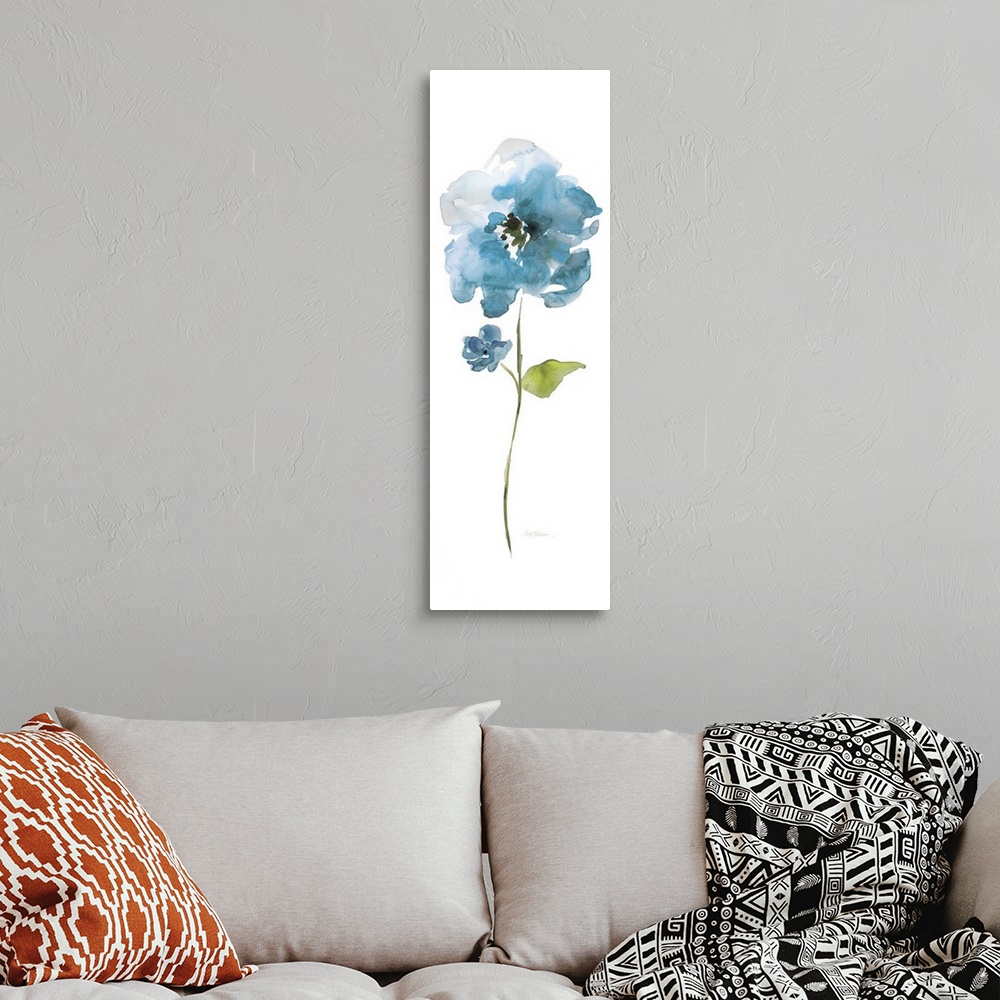 A bohemian room featuring Watercolor painting of a bright blue flower on a white background.