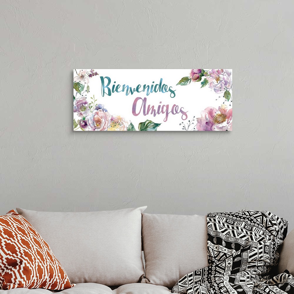 A bohemian room featuring The words "Bienvenidos Amigos" is delicately illuminated with assorted watercolor flowers and fol...