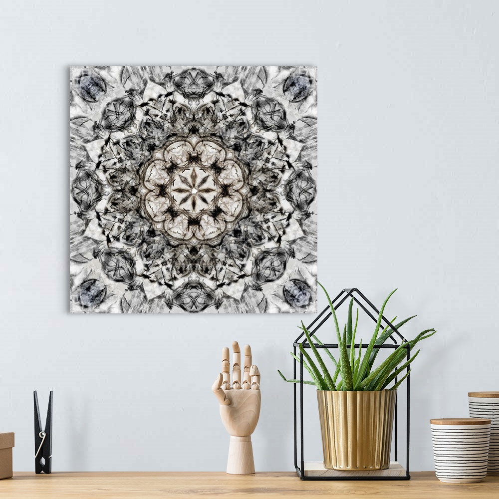 A bohemian room featuring Square abstract art in black and white hues with kaleidoscope-like patterns and designs.