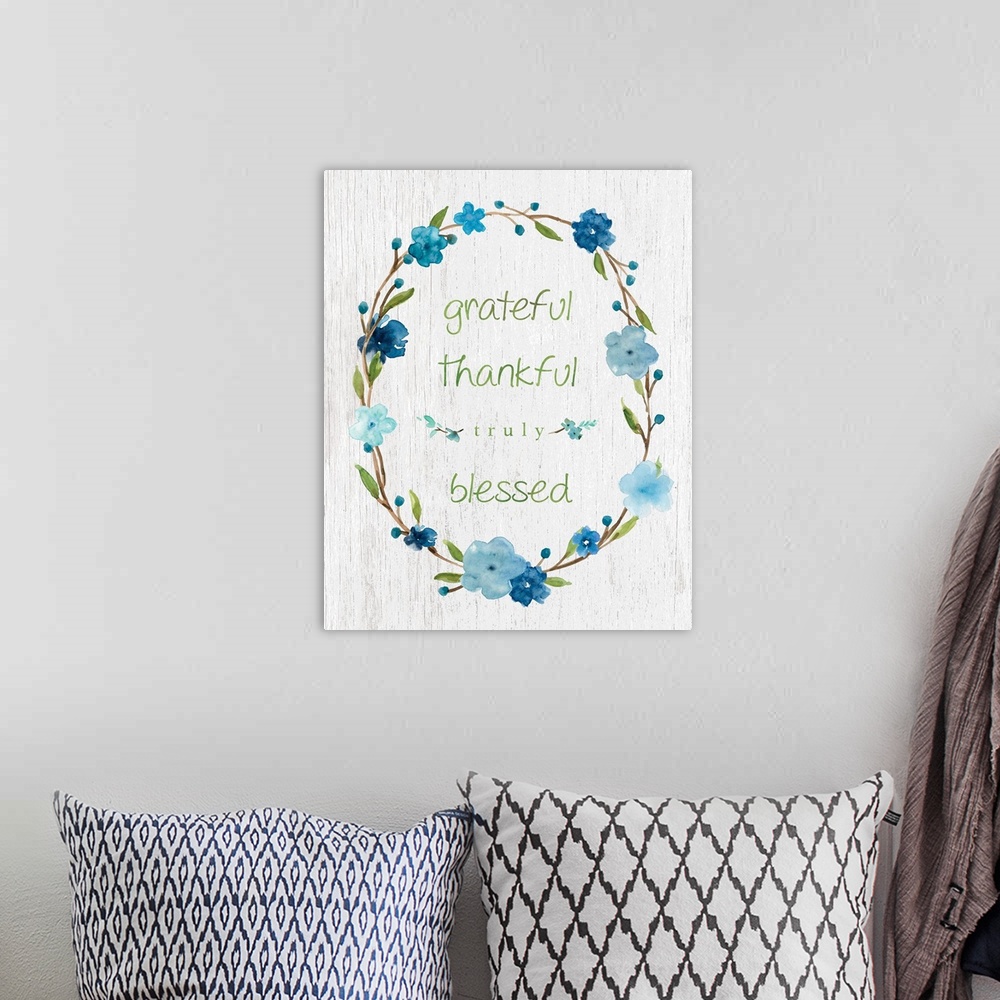 A bohemian room featuring "Grateful, Thankful, Truly Blessed" placed on a white textured background with blue flowers surro...