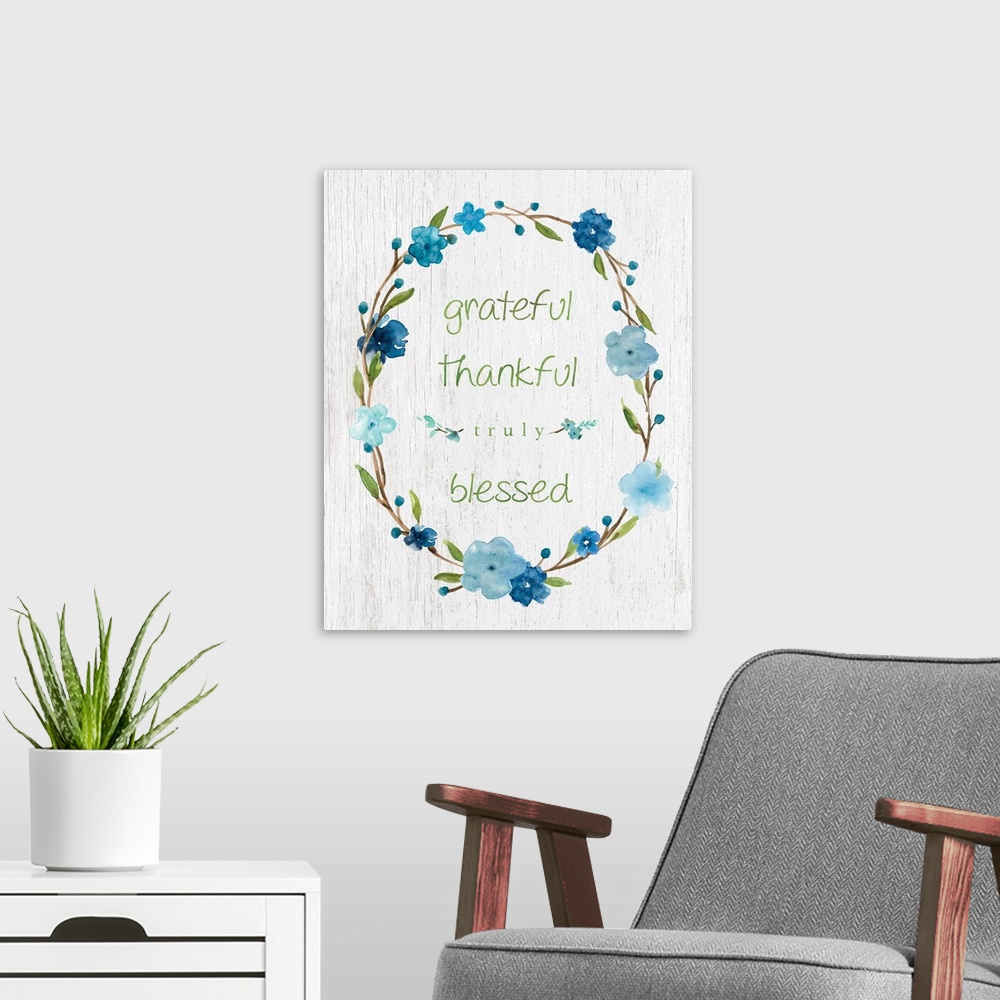 A modern room featuring "Grateful, Thankful, Truly Blessed" placed on a white textured background with blue flowers surro...