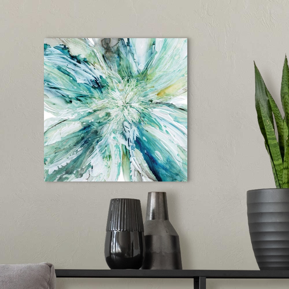 A modern room featuring Square abstract painting of a large flower with thick layered paint in shades of blue, yellow, gr...