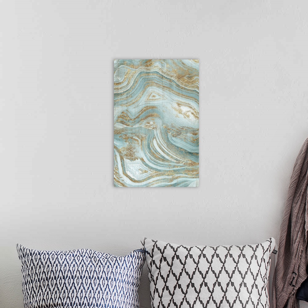 A bohemian room featuring A painting of a cool toned blue and gold grain agate with flowing designs and patterns.