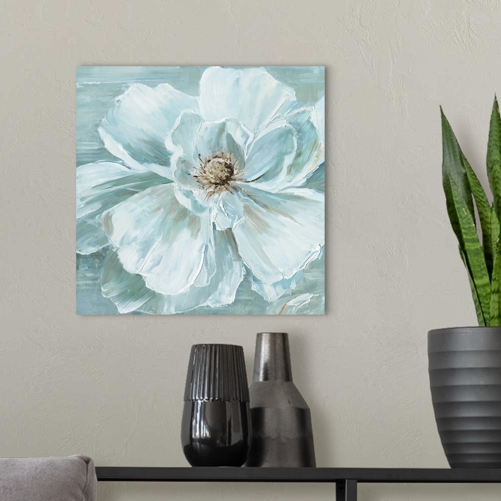 A modern room featuring A square contemporary painting of a large blooming flower in muted shades of white and blue.