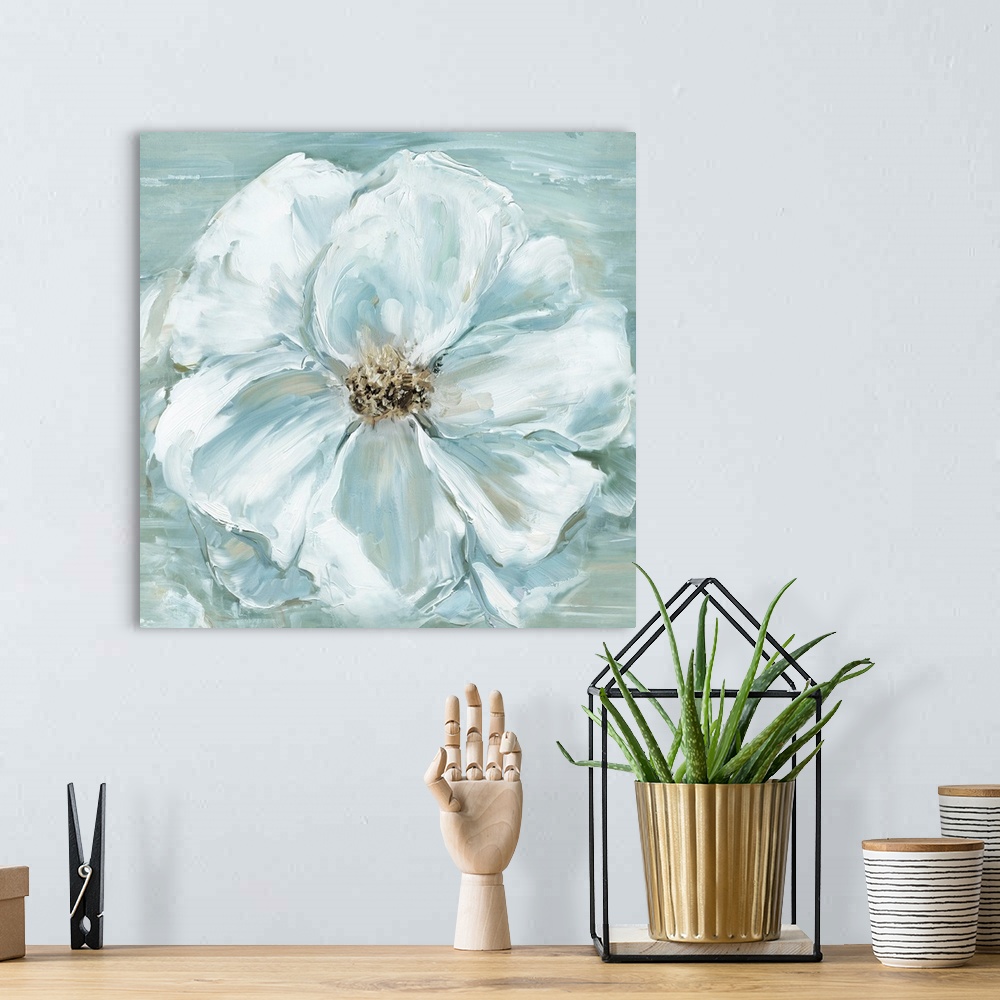A bohemian room featuring A square contemporary painting of a large blooming flower in muted shades of white and blue.