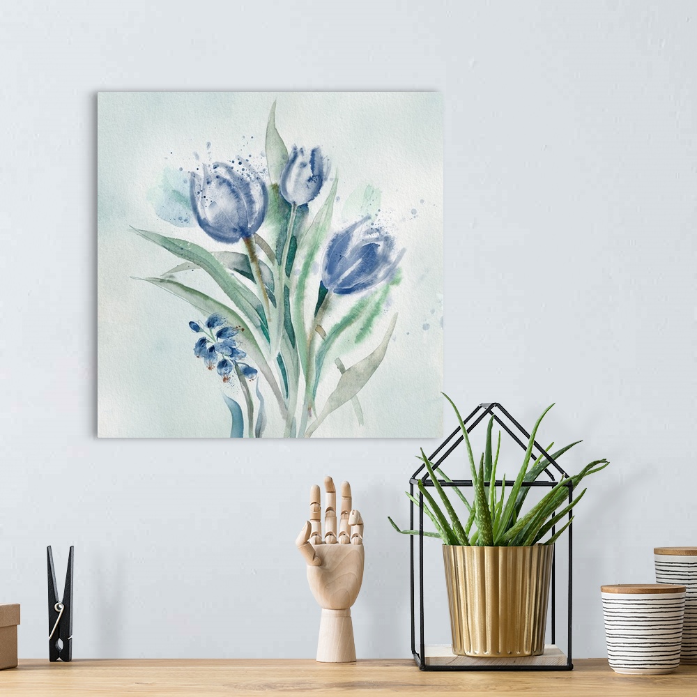 A bohemian room featuring A watercolor painting of blue flowers with speckled accents.
