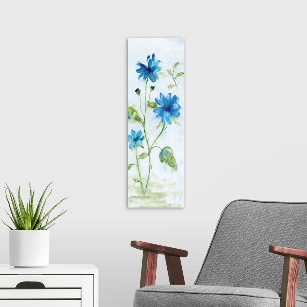 A modern room featuring Watercolor art print of bright blue flowers on a pale grey background.