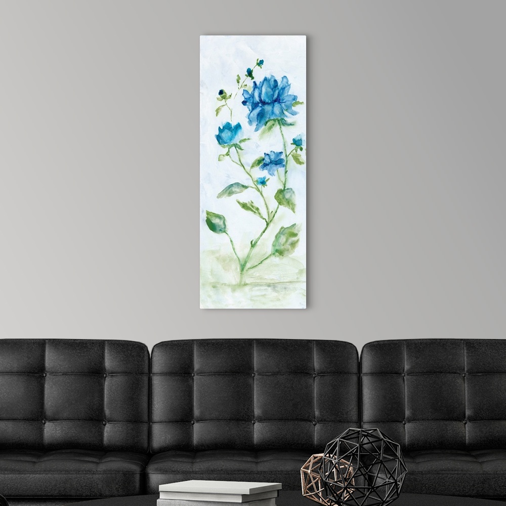 A modern room featuring Watercolor art print of bright blue flowers on a pale grey background.