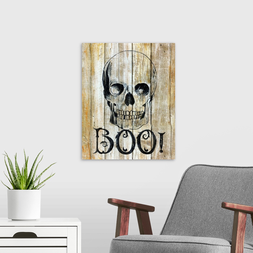 A modern room featuring A painting of a skull on a wooden background with the word ?BOO!? underneath.�