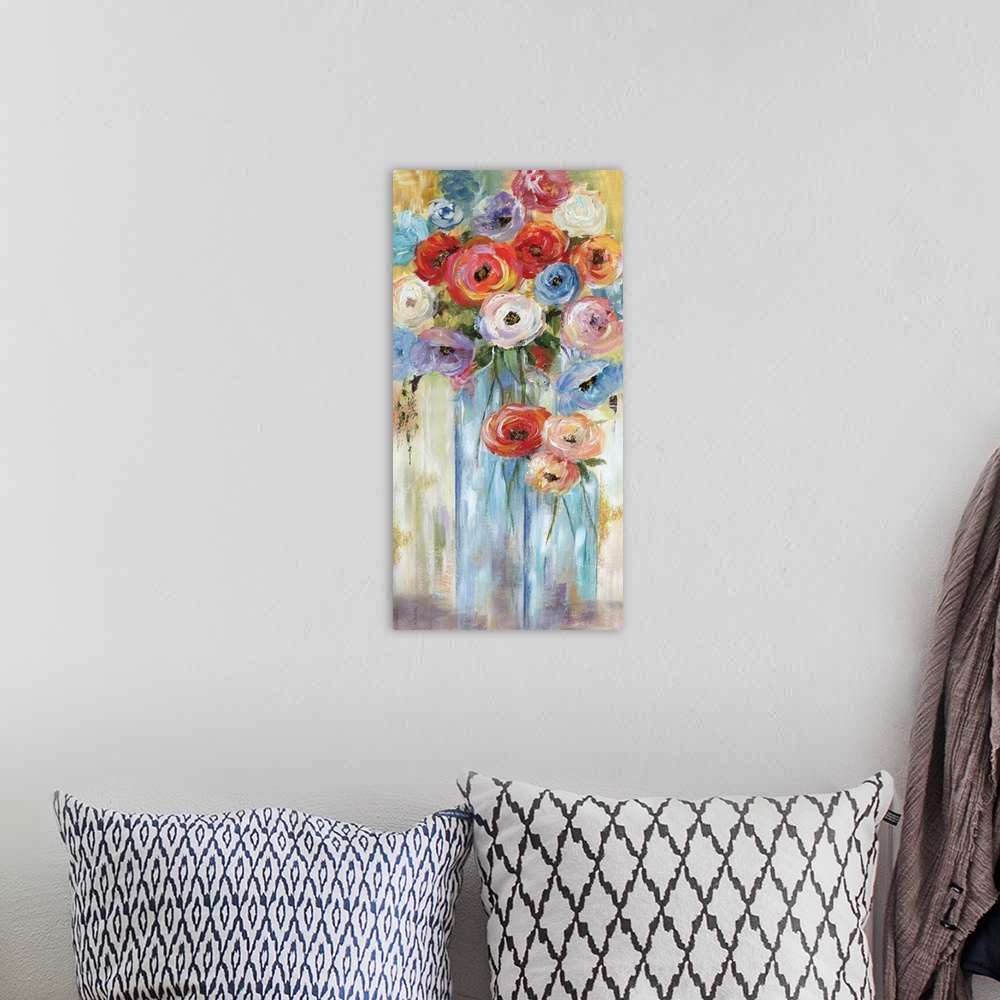 A bohemian room featuring A long vertical contemporary painting of vibrant colored flowers in glass vases.