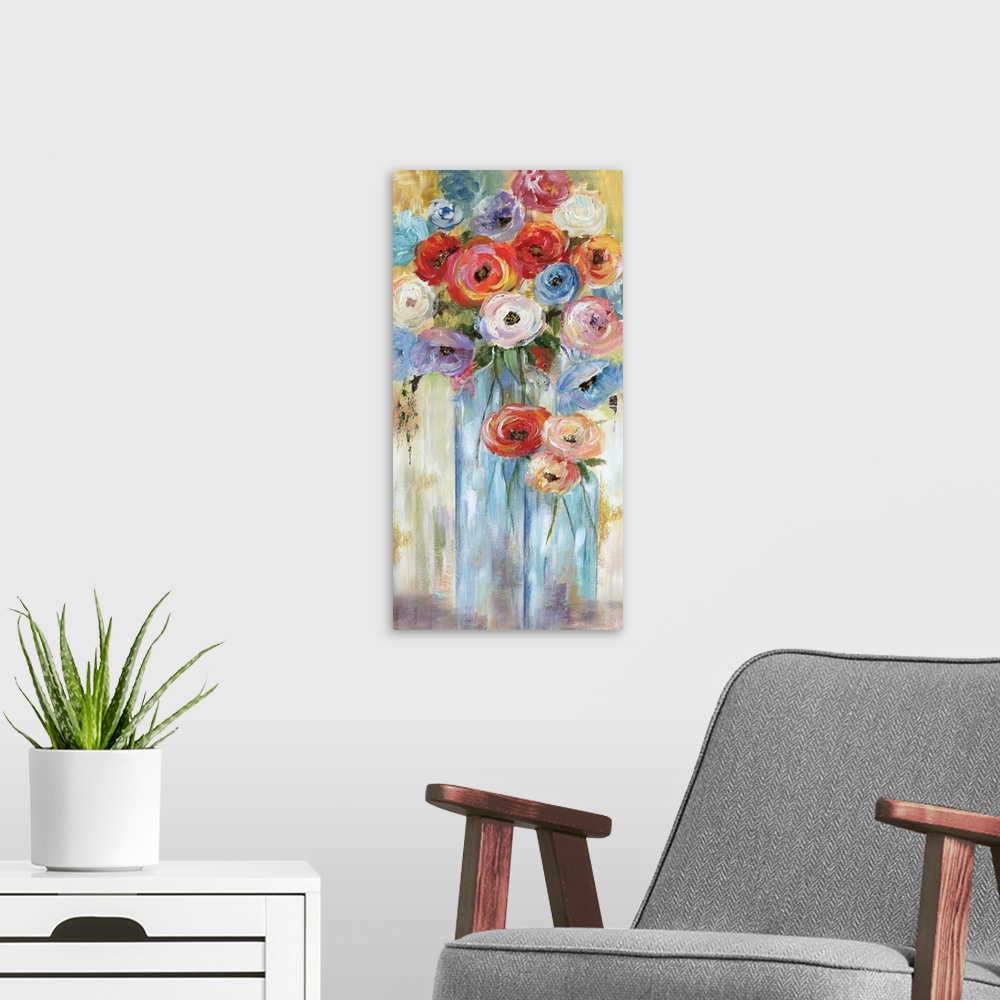 A modern room featuring A long vertical contemporary painting of vibrant colored flowers in glass vases.
