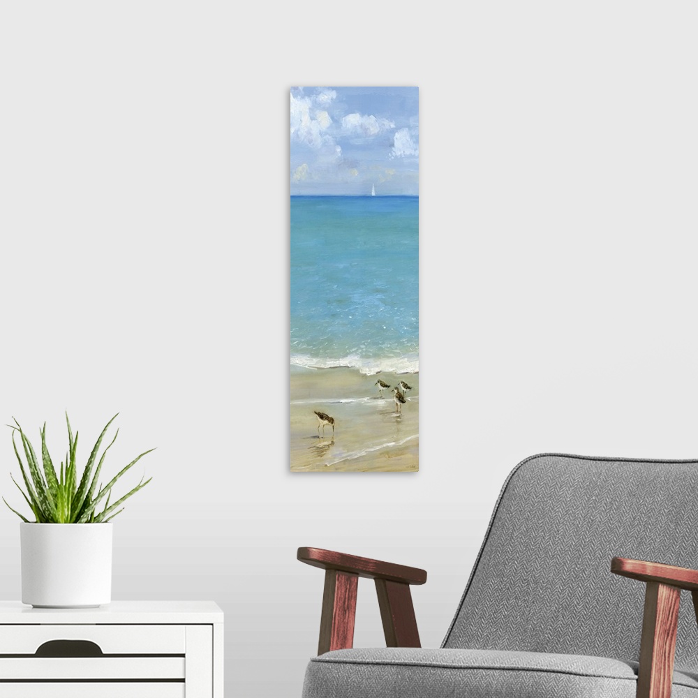A modern room featuring Tall contemporary painting of seabirds on the shore with blue water and a sailboat in the backgro...