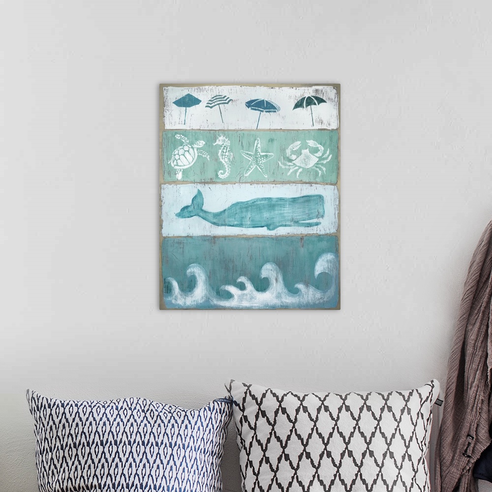 A bohemian room featuring A distressed beach themed sign with various marine animals.