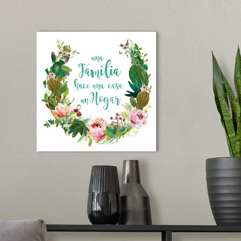 A modern room featuring A wreath of cacti, various flowers and foliage surround the words, "Una Familia hace una casa un ...