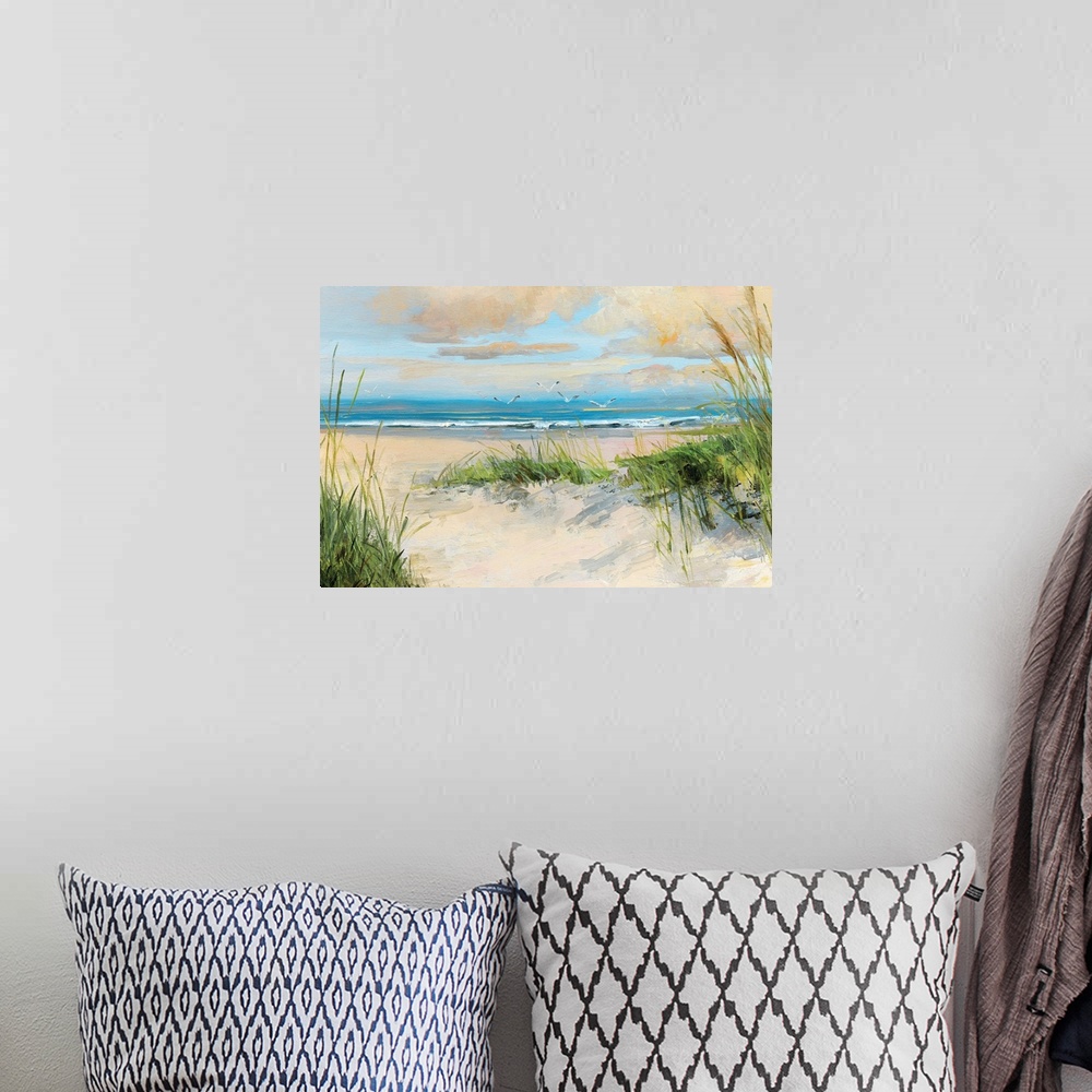 A bohemian room featuring Contemporary painting of a sandy beach with birds flying towards the ocean.