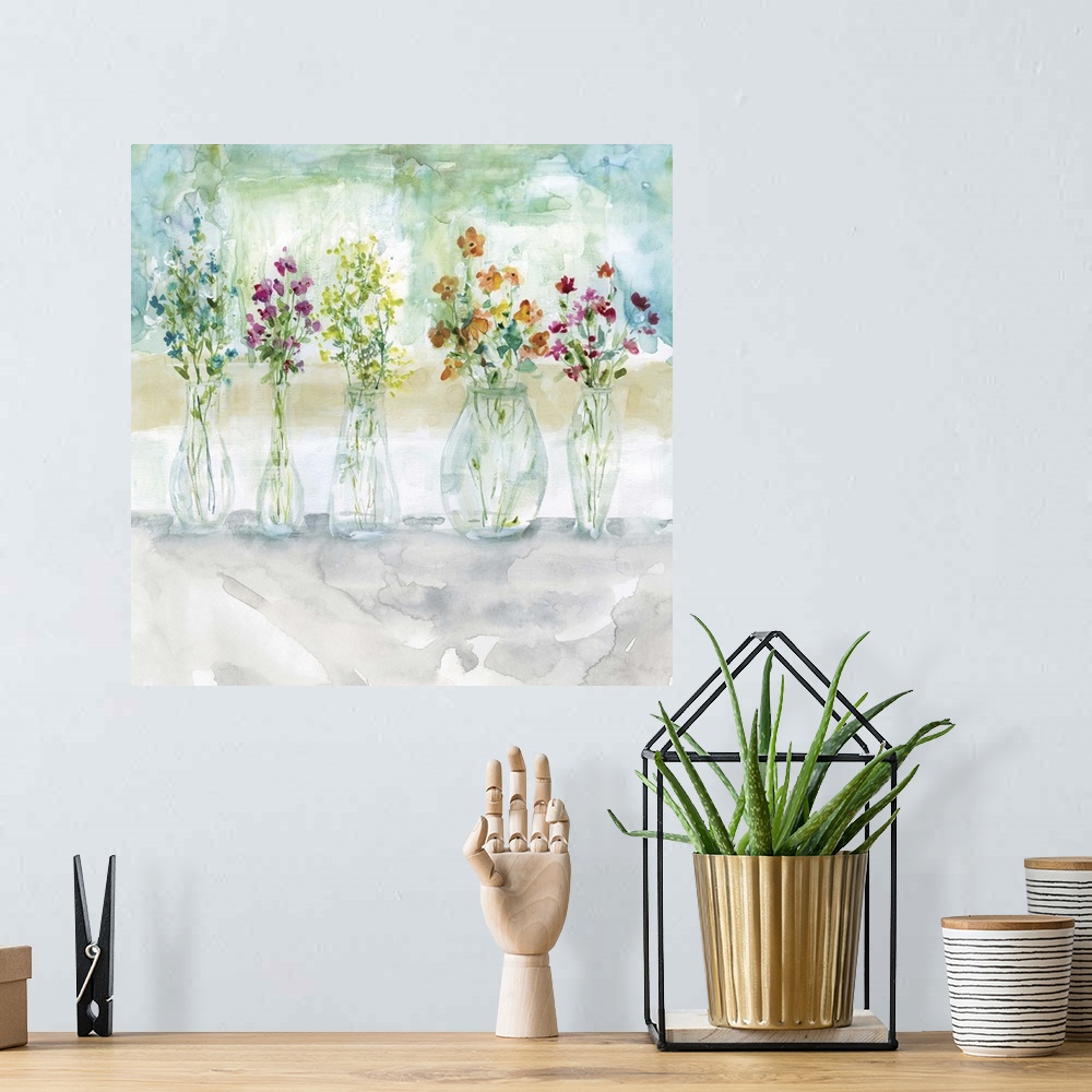 A bohemian room featuring Square watercolor painting of five vases filled with wildflowers.
