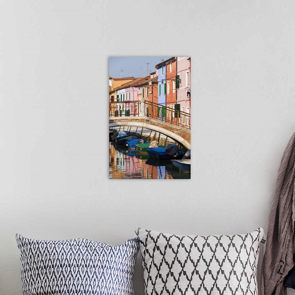A bohemian room featuring Italy, Burano. Reflection of colorful houses in canal.